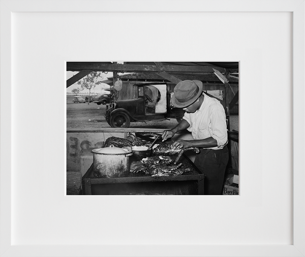 Man slicing barbecue at the Gonzales County Fair