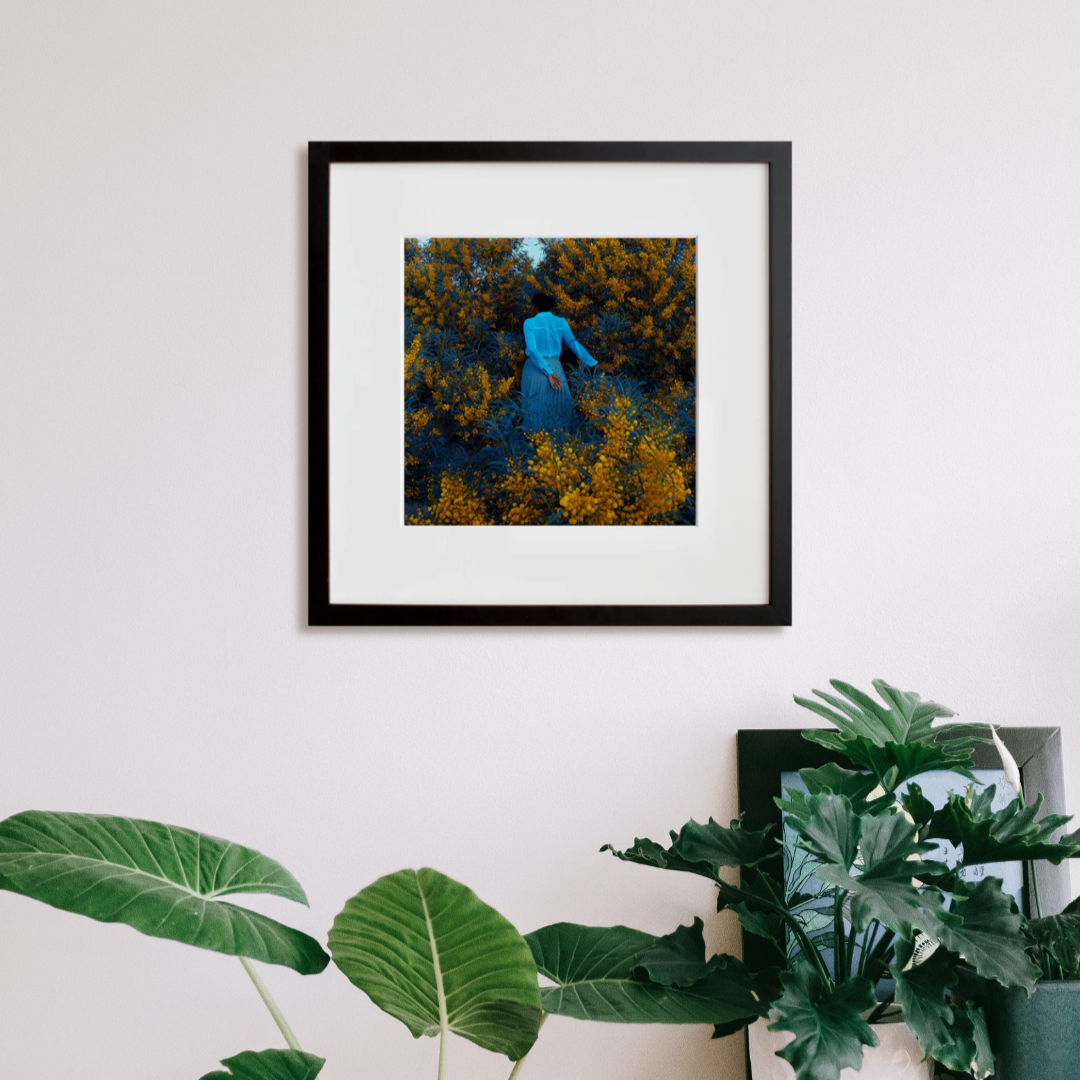 The moment is now in a black frame on a wall