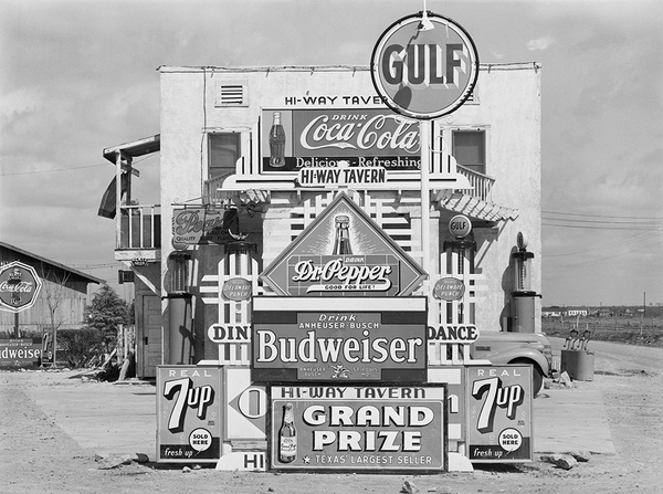 Russell Lee's Signs in front of highway tavern. Crystal City, Texas