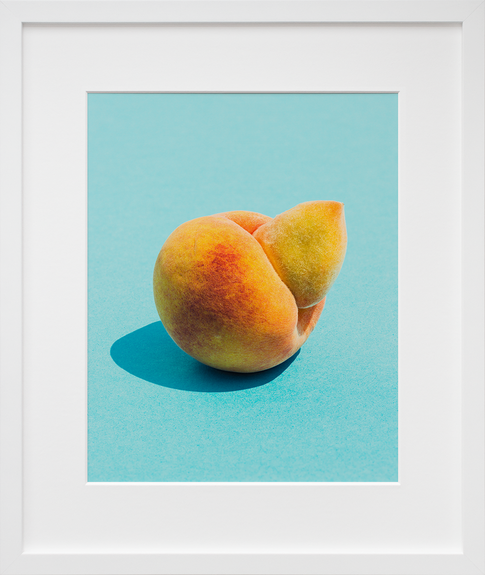 Ugly Peach in a white frame