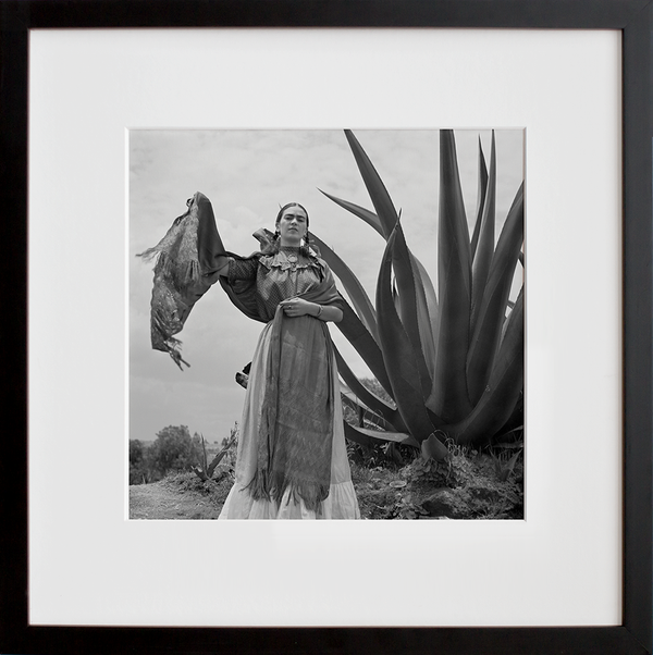 Load image into Gallery viewer, Frida Kahlo standing next to an agave plant
