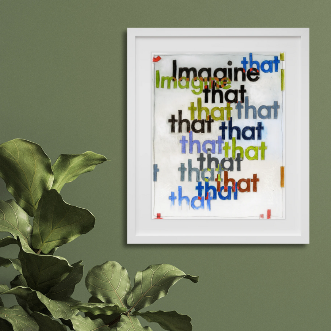 Imagine That in a white frame on a wall