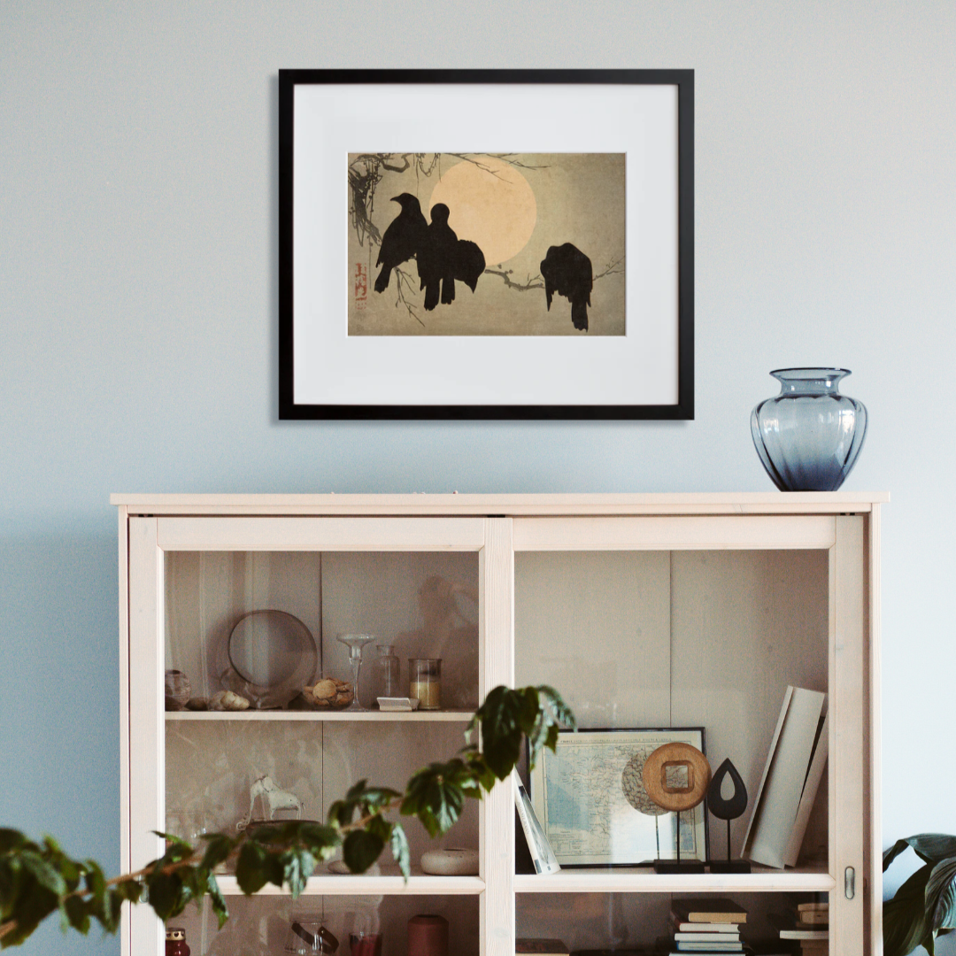 Crows in the Moonlight in a black frame on a wall