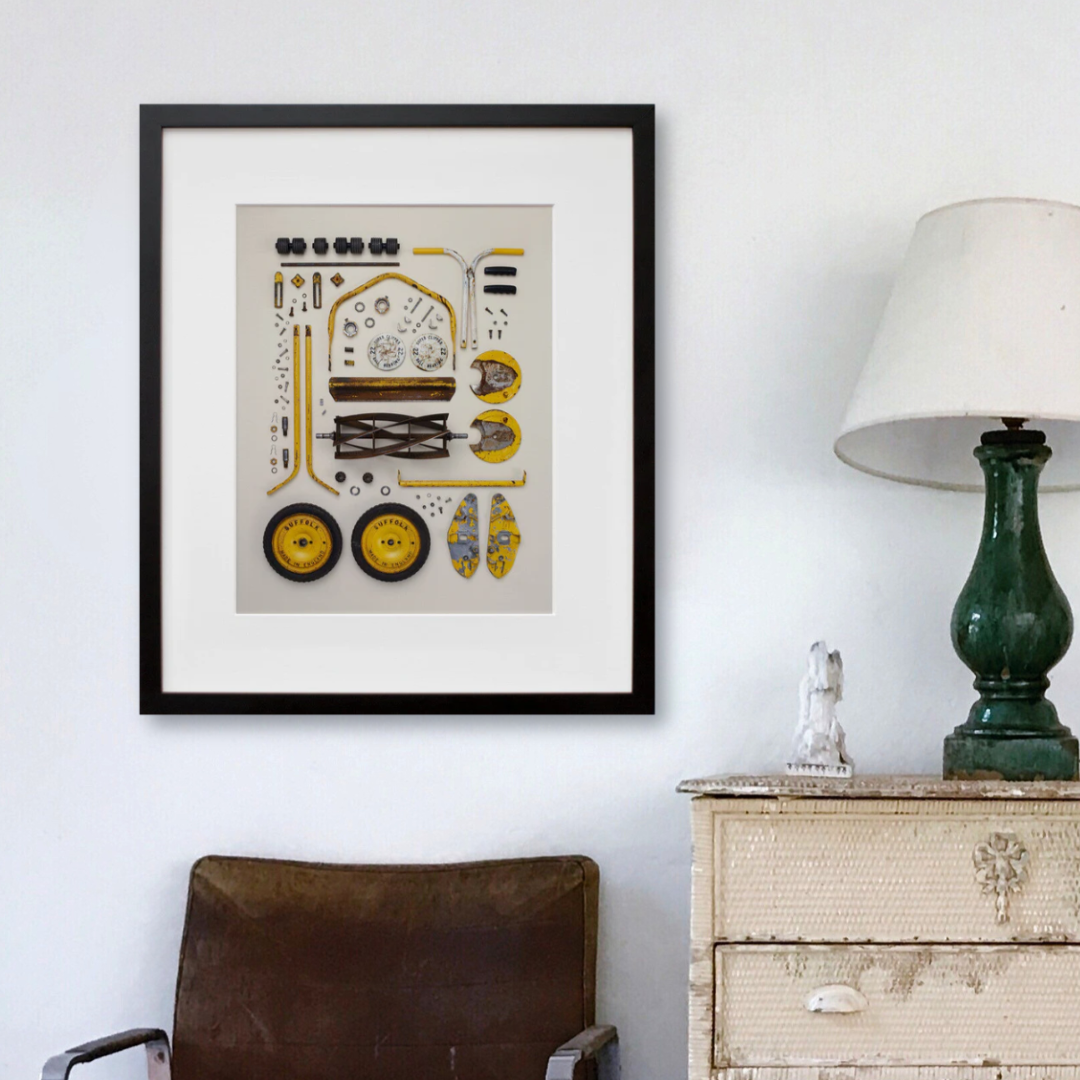 Old Push Lawn Mower in a black frame on a wall