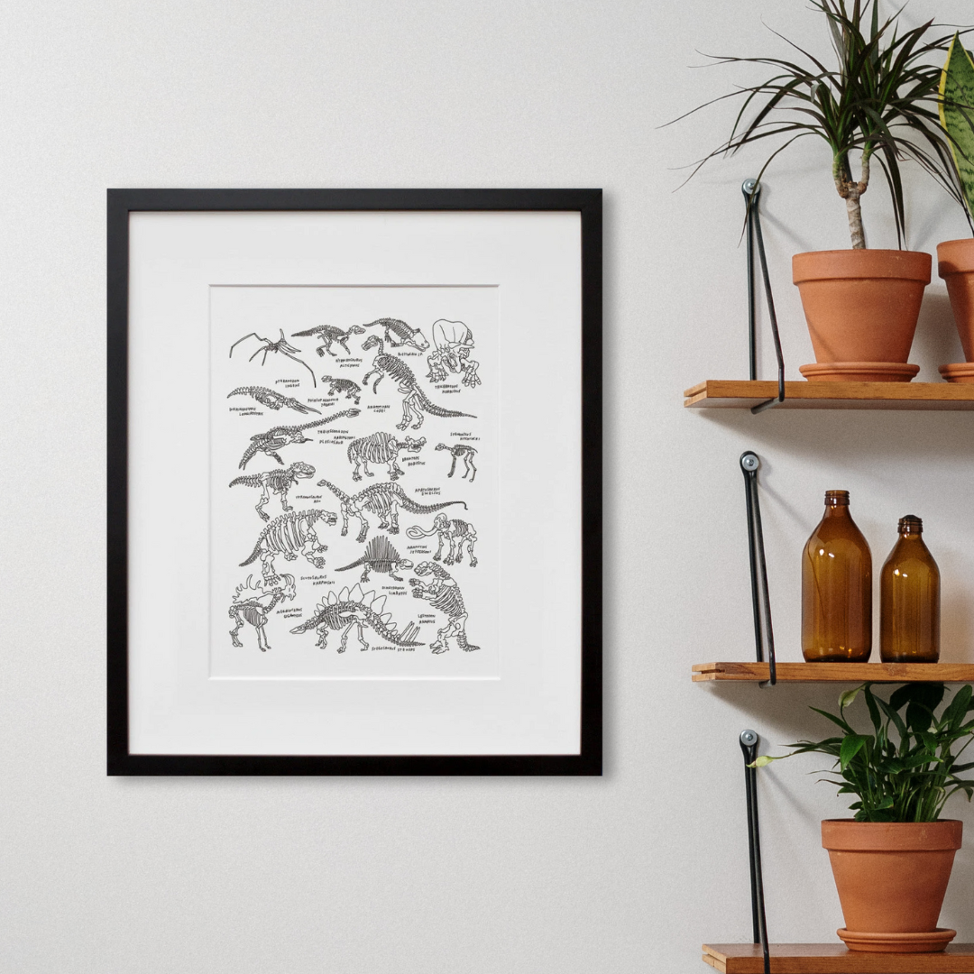 Dinosaurs at The American Museum of Natural History in a black frame on a wall