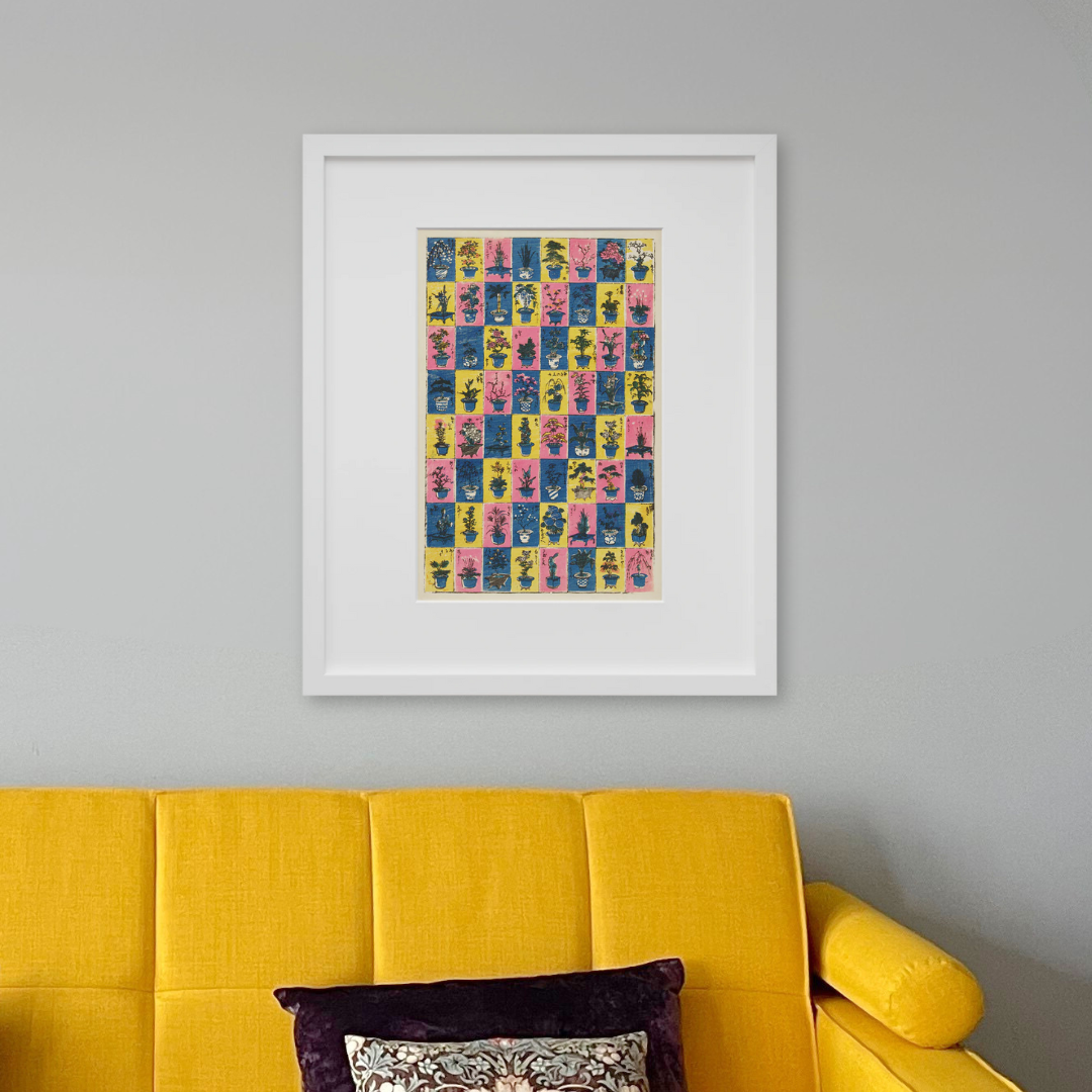 Plants and Flower Arrangements in a white frame on a wall