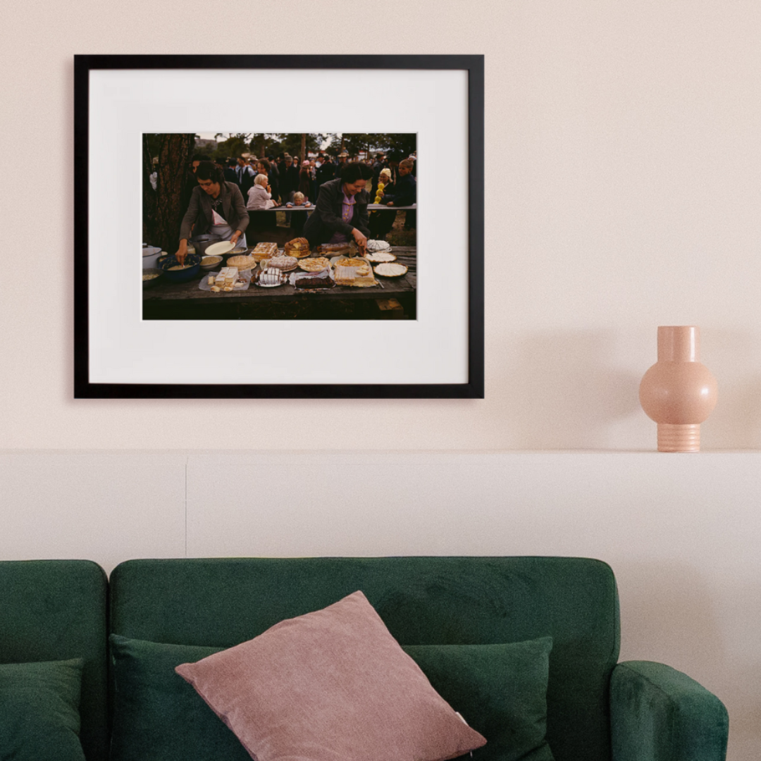 Cutting the pies and cakes in a black frame on a wall