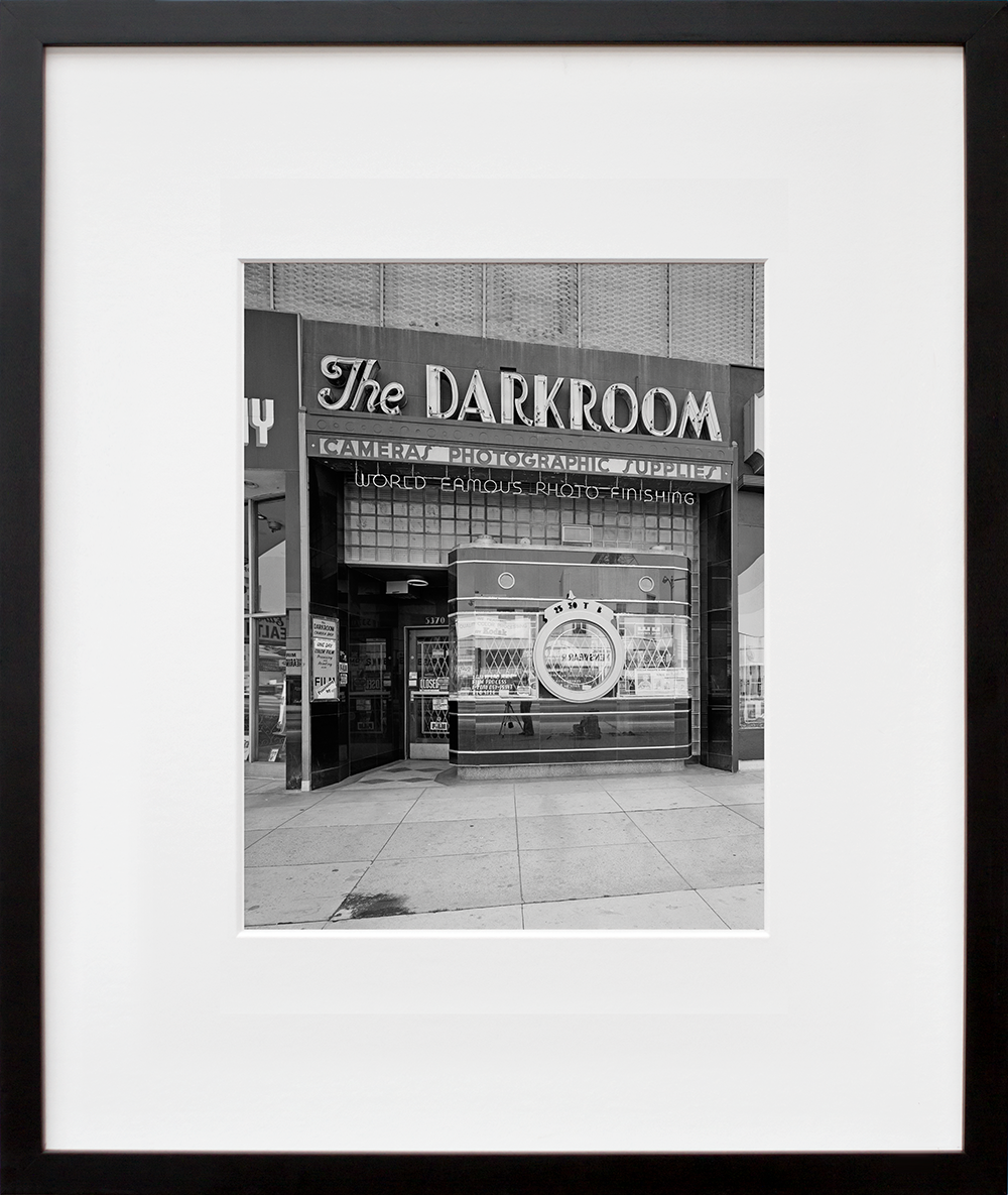 The Dark Room in a black frame