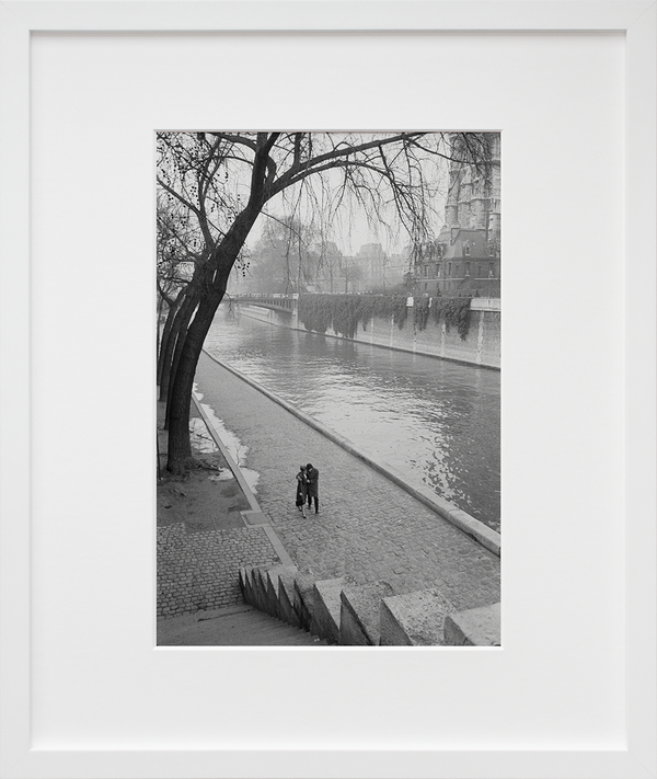 Load image into Gallery viewer, A couple walking along the Seine River in Paris

