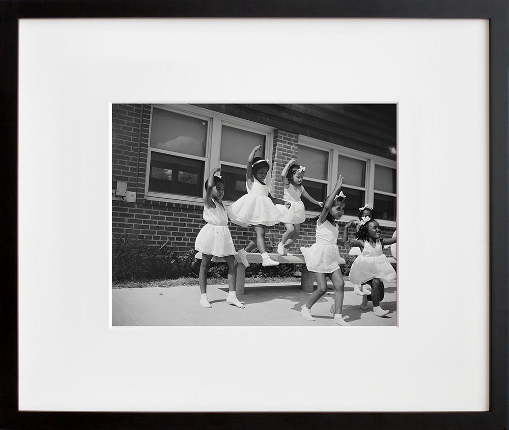A dance group: Frederick Douglass housing project in a black frame