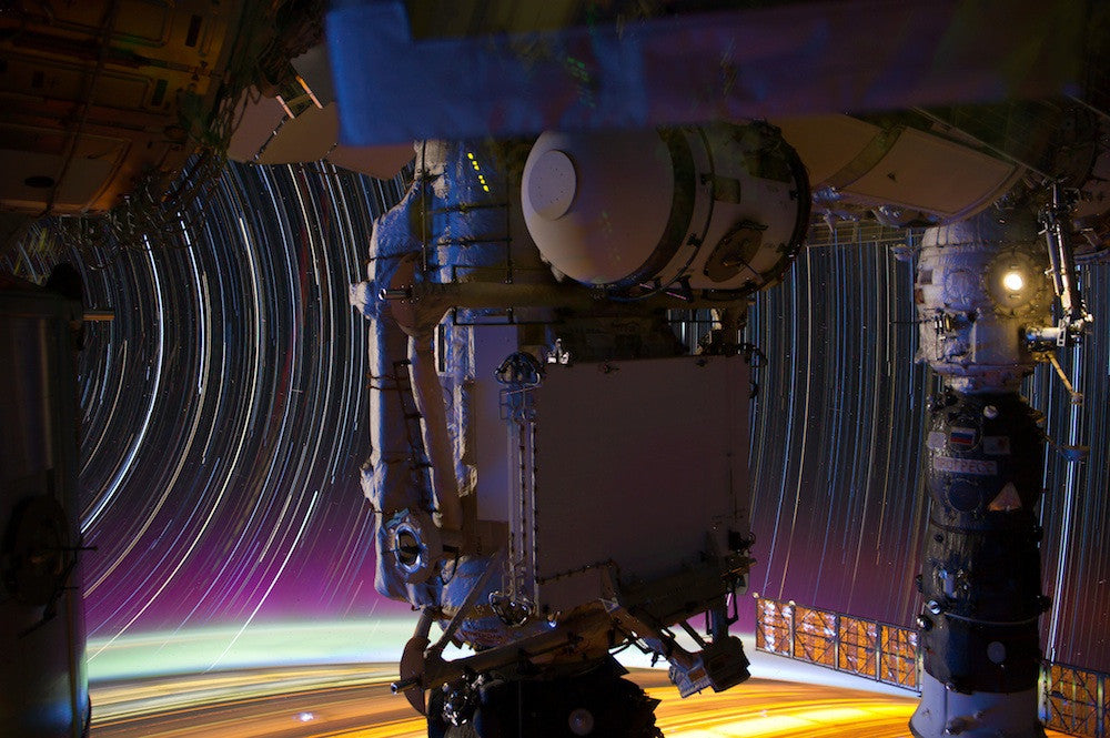 jsc2012e051507_alt: star trails and city lights seen past the International Space Station