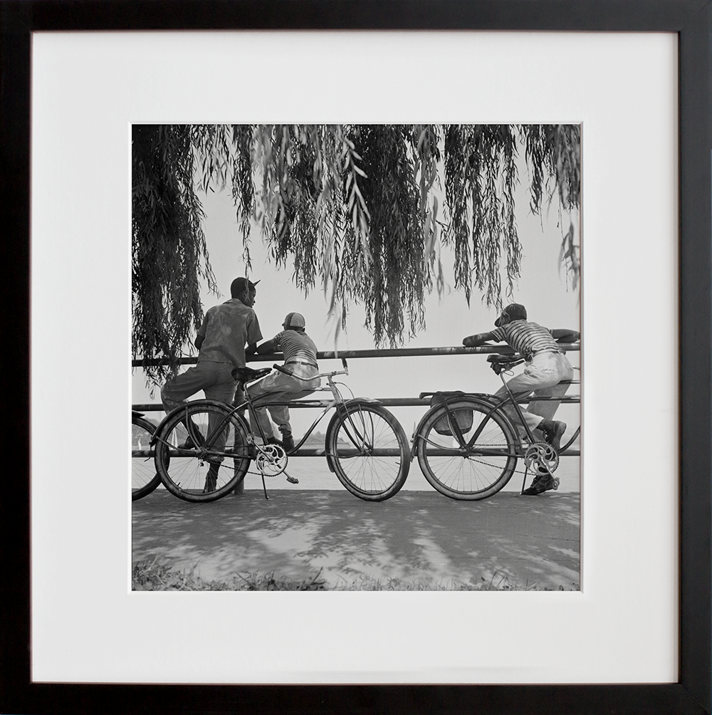Washington, D.C. Sunday cyclists watching sailboats in a black frame